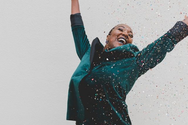 A happy woman celebrating.